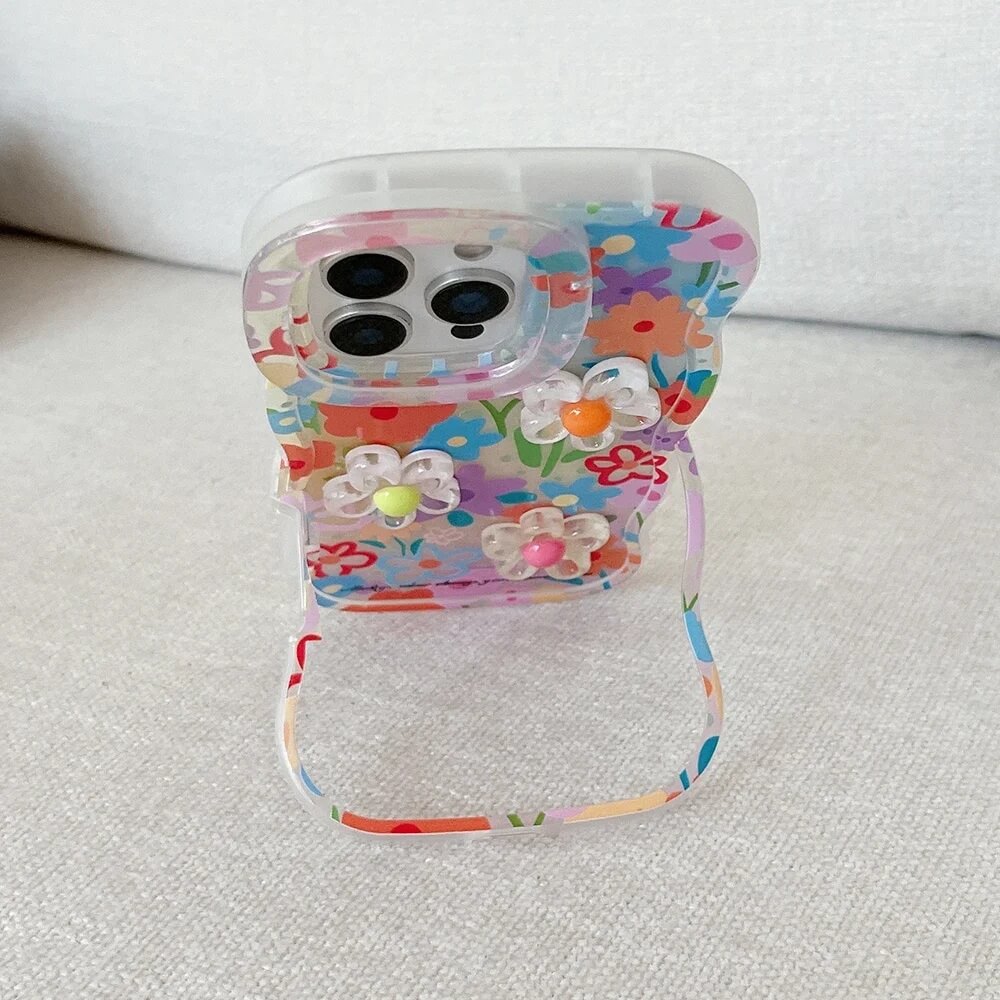 Daisy Clear iPhone Case with Bracelet Charm and Fold-Out Stand Daisy Clear iPhone Case with Bracelet Charm and Fold-Out Stand